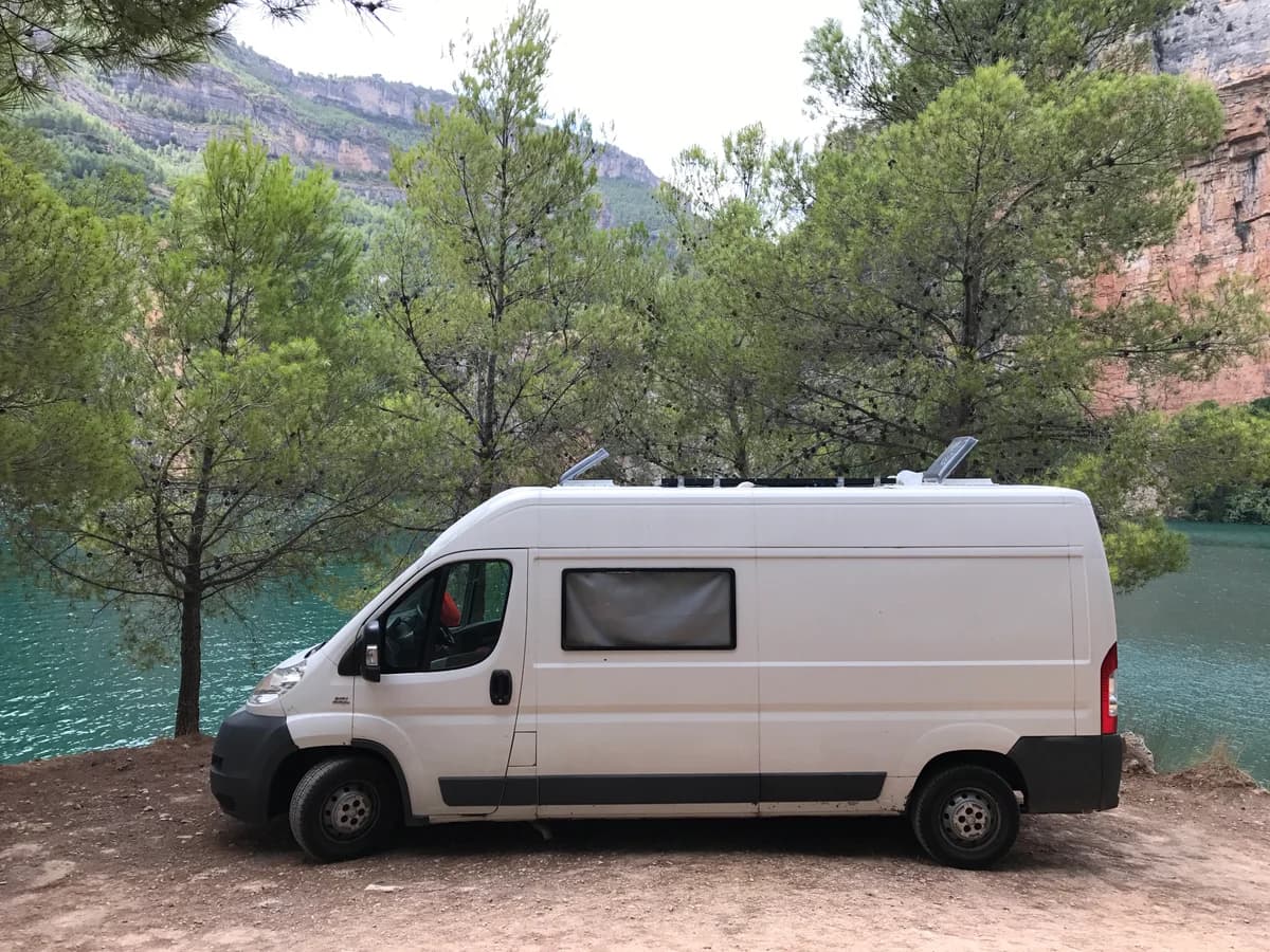 Our camper parked among the trees